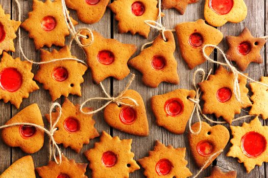 Christmas homemade gingerbread cookies over wooden table