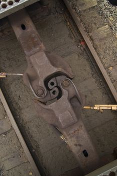 A coupling holds two railroad cars together