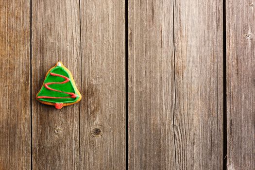 Christmas homemade gingerbread cookie over wooden table