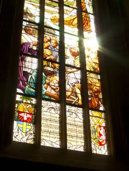 Detail of the color window - bullseye pane - lattice window.
Public national monument - cathedral of St Barbara, Kutna Hora, Czech republic, Europe.