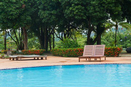 Wood chairs on pool deck