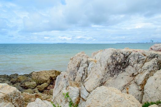 The rocks along the shoreline on the beach