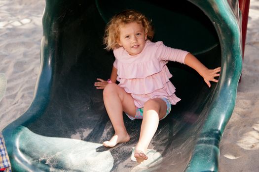 Having fun at playground in the park on Saturday morning.