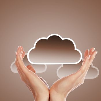 Hand with cloud computing symbol against colour background