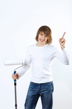 Portrait of young man with paint brushes