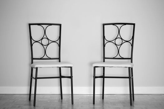 Chairs against wall in a new apartment