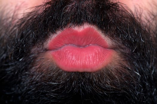 Kiss from a man with a beard who wearing lipstick