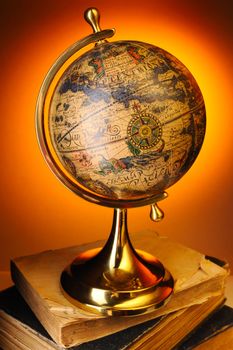 Antique globe on old books