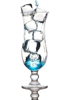 Pouring Blue Curacao cocktail in glass