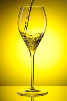 Pouring white wine into a glass