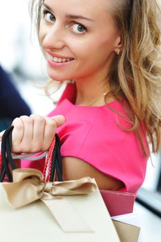 Woman with bags in shopping mall