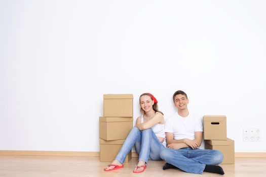 Young couple resting from moving into a new home