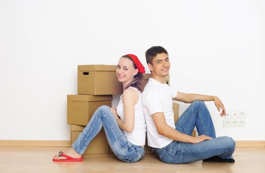 Young couple resting from moving into a new home
