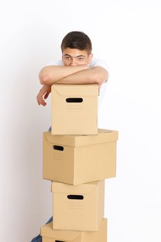 Young man with a stack of boxes