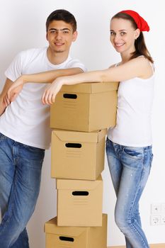 Young couple resting from moving into a new home