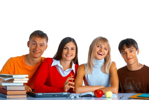 Group of students sit at the desk and smile on white background