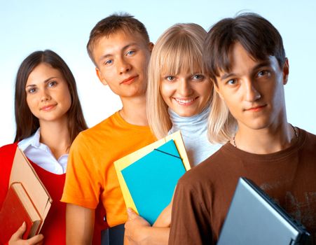  Casual group of college students smiling stand in a row with books on white 