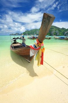 Traditional Thai boat in beautiful beach landscape in Thailand