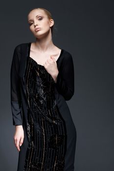Portrait of a beautiful elegant model in black dress, posing.