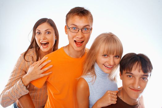 Young friends laughing together standing in a row
