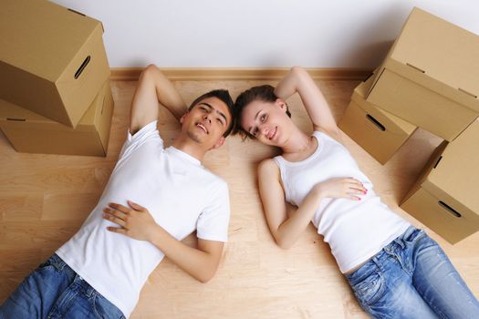 Young couple resting from moving into a new home