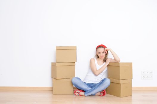 Woman resting from moving into a new home 