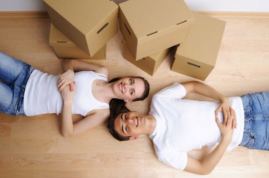 Young couple resting from moving into a new home