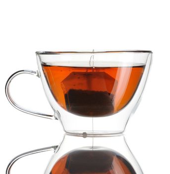 Teabag in the cup with hot water