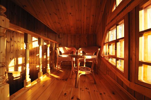 Wooden interior with wicker furniture