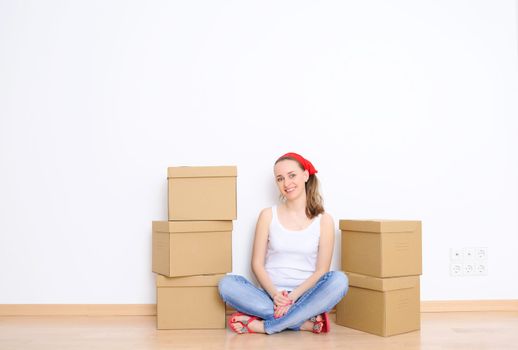 Woman resting from moving into a new home. Great copy space.