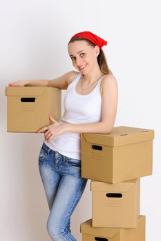 Young woman with a stack of boxes