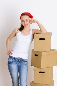 Young woman with a stack of boxes