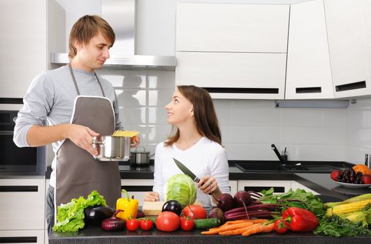 Couple cooking in modern kitchen