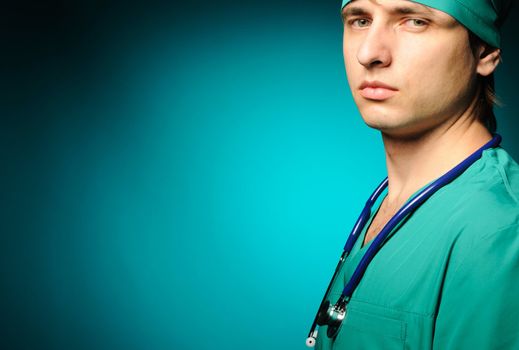 Surgeon with stethoscope over blue background