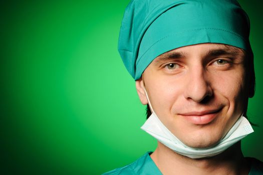 Surgeon with mask over green