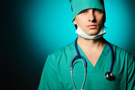 Surgeon with stethoscope over blue background