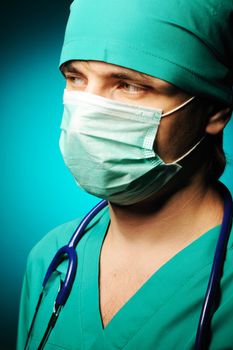 Surgeon with stethoscope over blue background