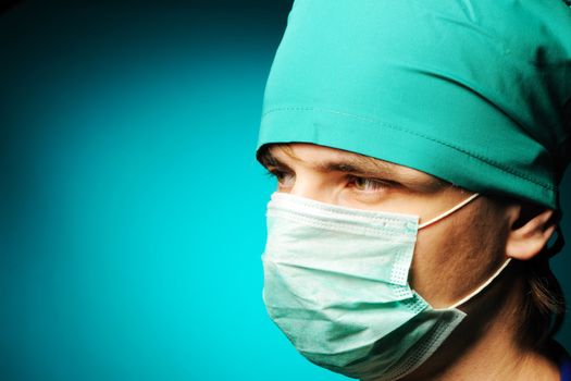 Surgeon in mask close-up portrait