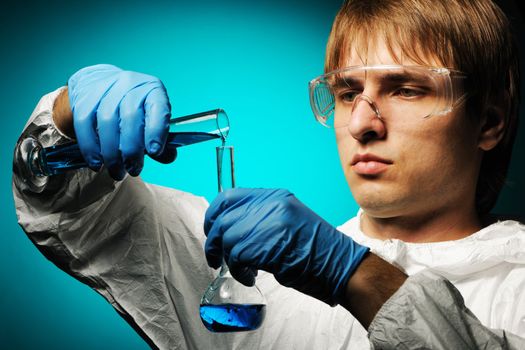 Scientist in protective wear and glasses 