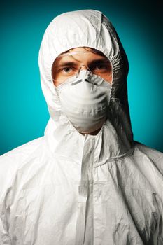 Scientist in protective wear, glasses and respirator 