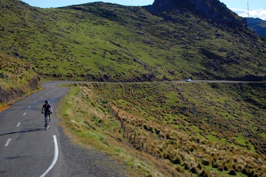 Cyclist riding on the Summit road between Christchurch and Lyttelton