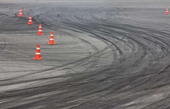Background with traffic cone on road track