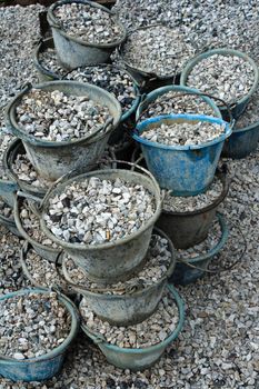 Pile crushed stone in tank