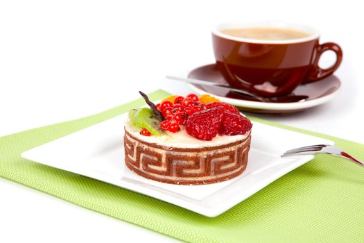 Low-calorie fruit cake with cup caffee, on white background