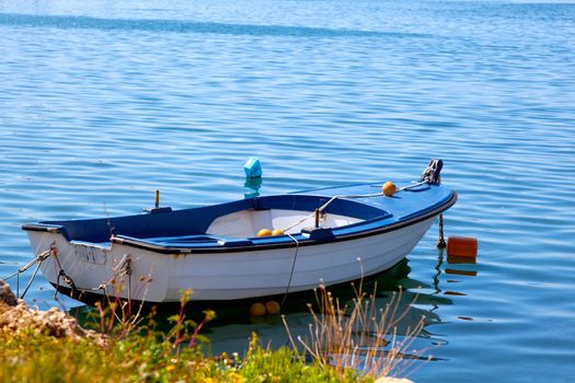 One fishing boat floating on the water
