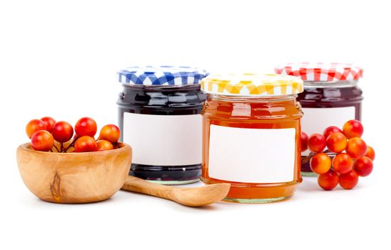 jars of marmalade with berry, isolated on white background