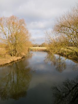 The river Avon in winter with tree reflections at Pershore