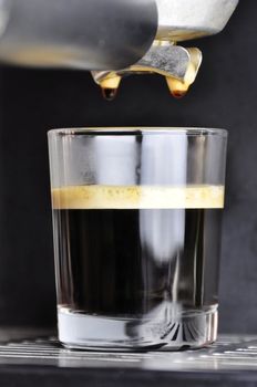 An espresso cafe served in a glass