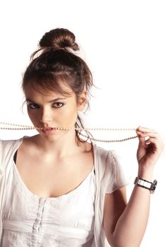 Brunette in studio posing with a necklace isolated on white