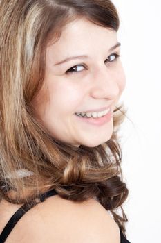 Portrait of a young brunette girl with brown eyes